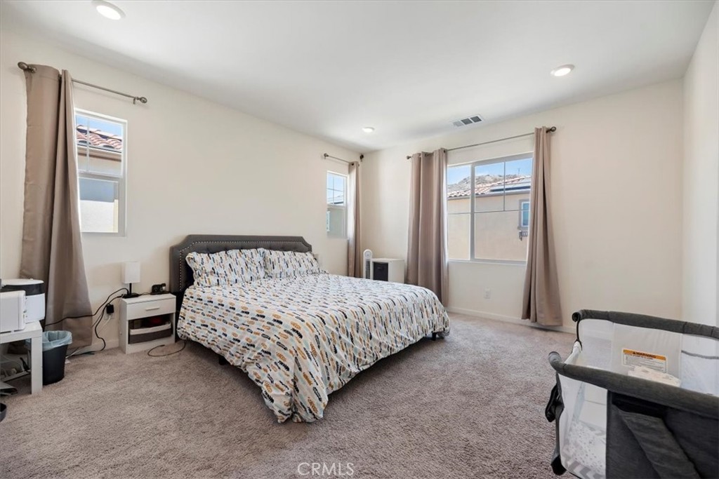 20911 Jennings Way Newhall, CA 91321 - Photo 34 of 47 a bedroom with a bed and a table in it