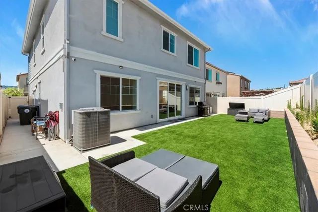 a view of a house and a back yard