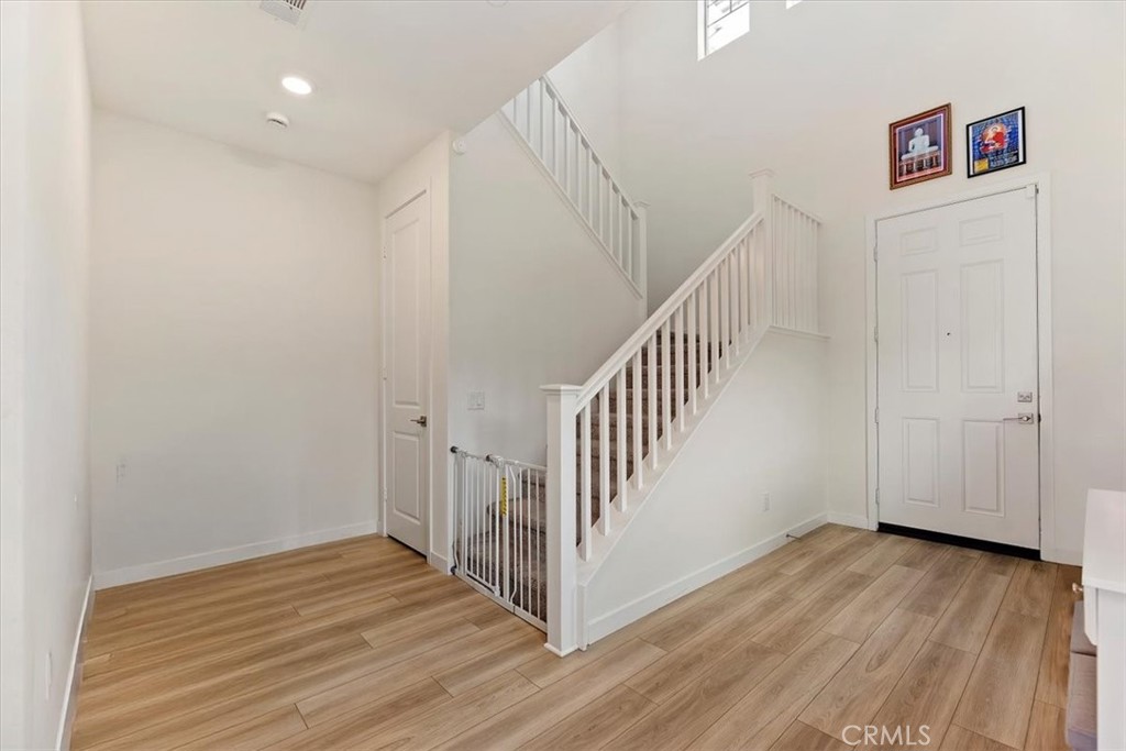 20911 Jennings Way Newhall, CA 91321 - Photo 7 of 47 a view of a hallway with wooden floor and entryway