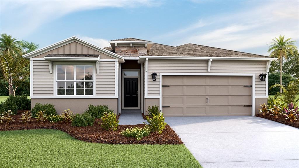 5815 Oak Bridge Lakewood Ranch, FL 34211 - Photo 1 of 1 a front view of a house with a yard and garage