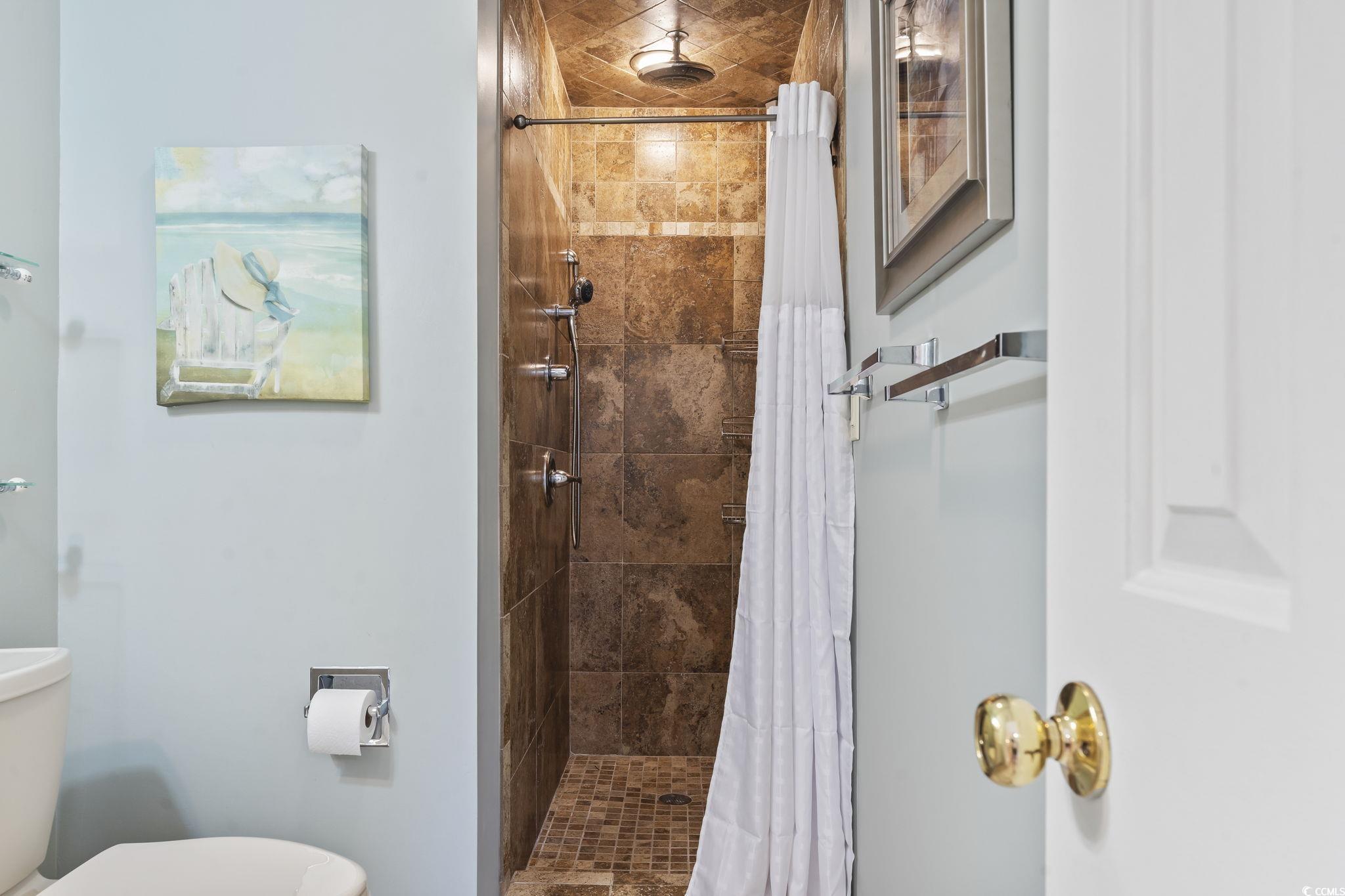 1425 North Waccamaw Drive, Unit 123 Murrells Inlet, SC 29576 - Photo 25 of 39 Bathroom with a tile shower