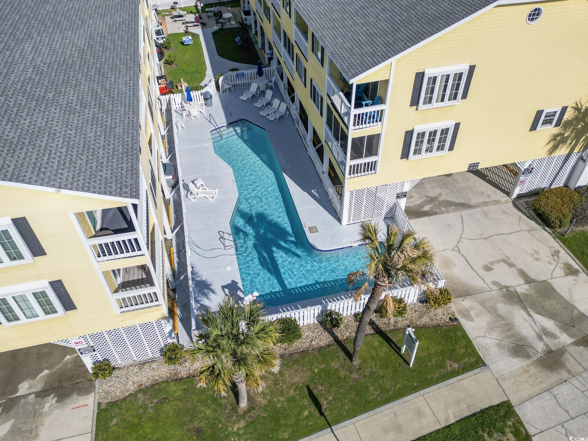 1425 North Waccamaw Drive, Unit 123 Murrells Inlet, SC 29576 - Photo 28 of 39 Drone / aerial view of a pool
