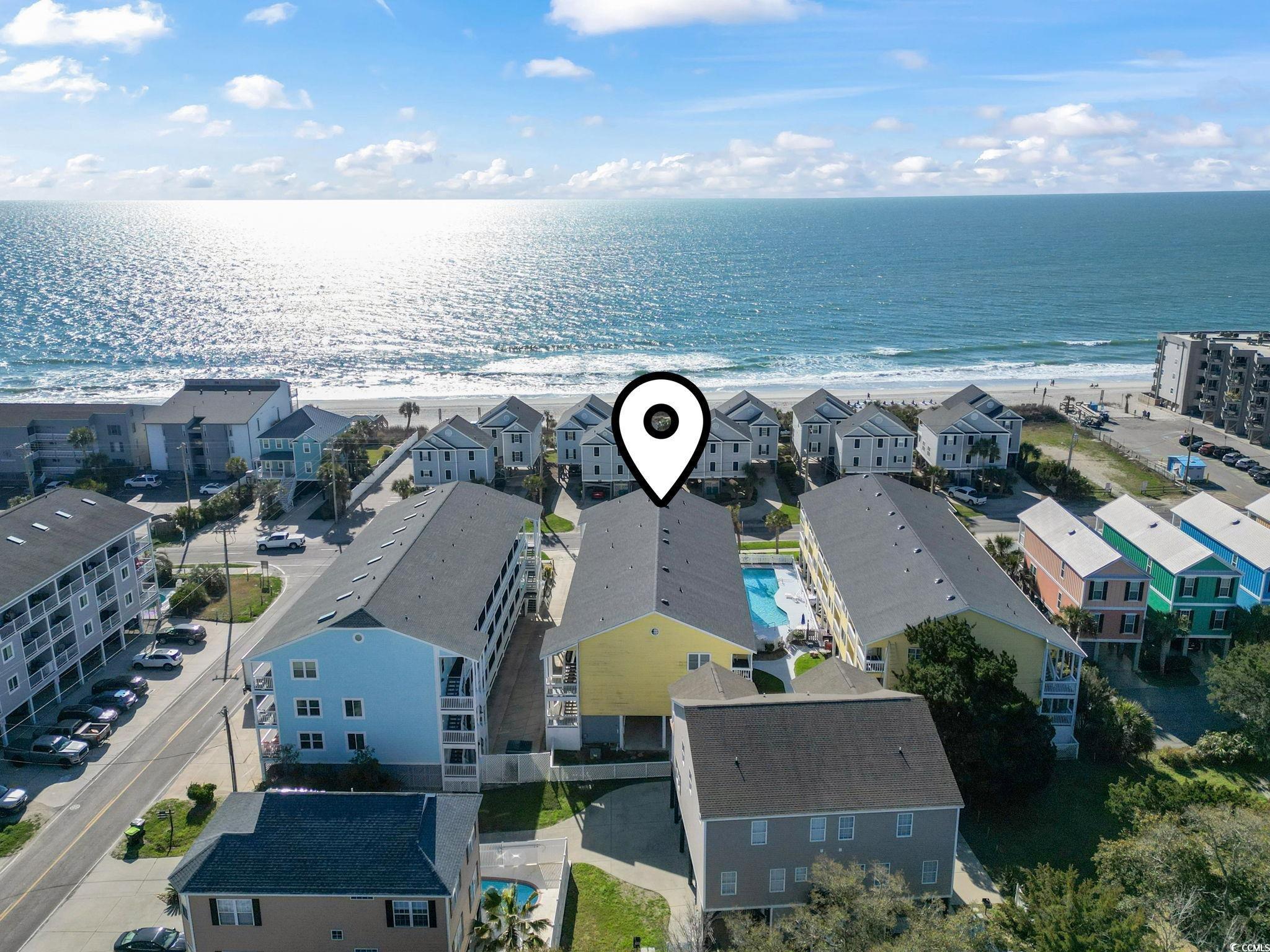 1425 North Waccamaw Drive, Unit 123 Murrells Inlet, SC 29576 - Photo 32 of 39 Aerial perspective of suburban area with unending shoreline