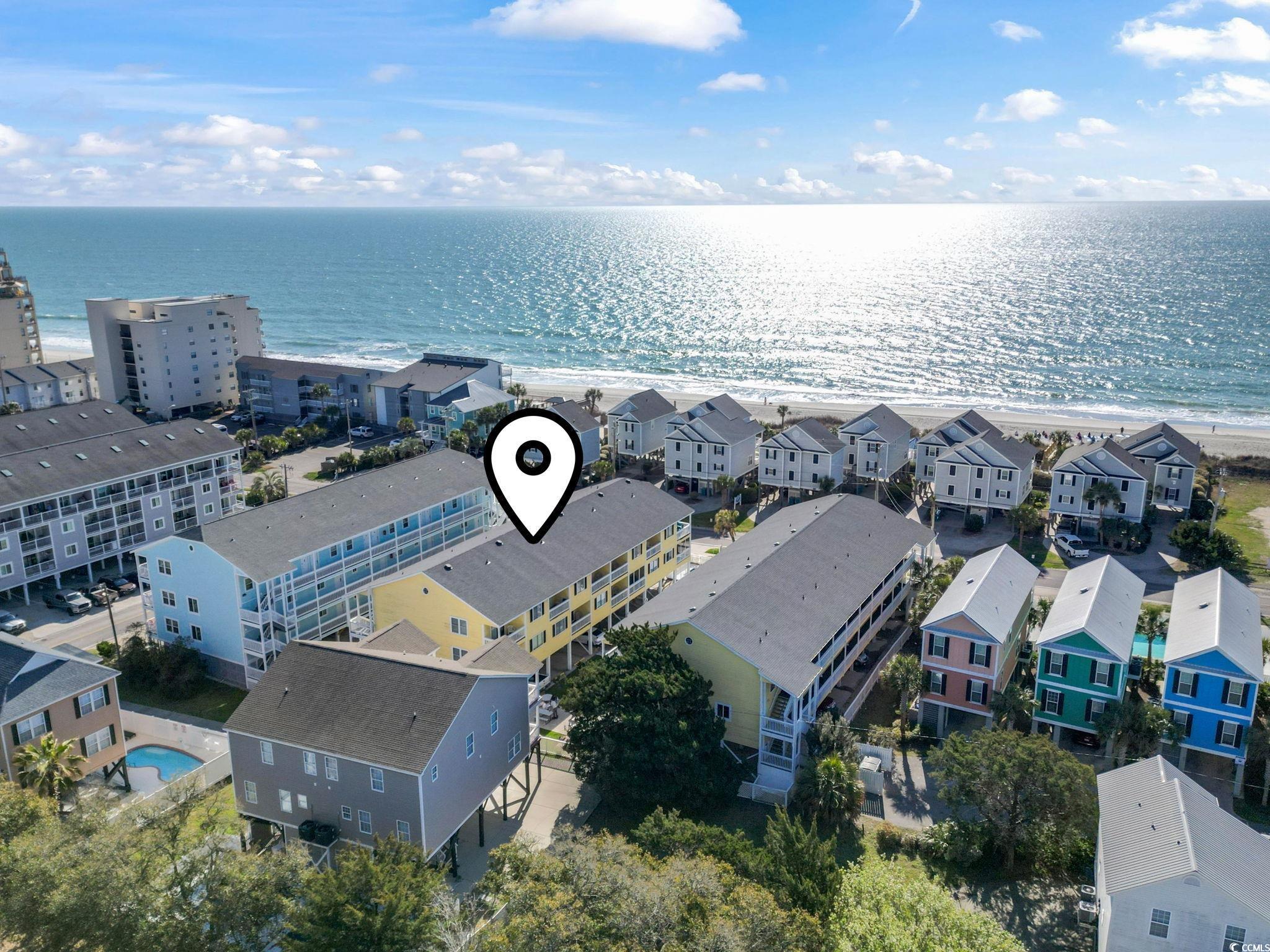 1425 North Waccamaw Drive, Unit 123 Murrells Inlet, SC 29576 - Photo 33 of 39 Drone / aerial view of waterfront with a beach