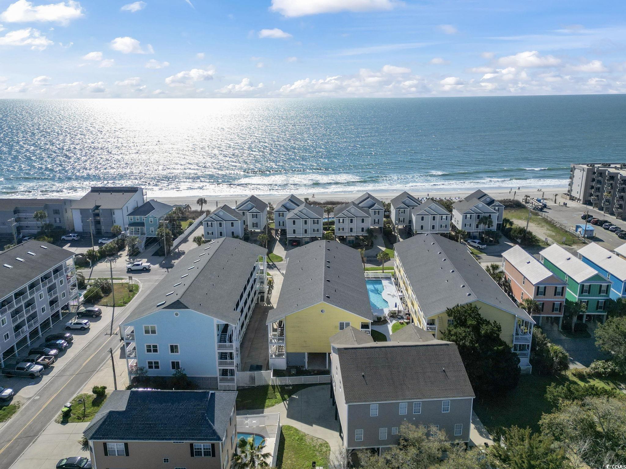 1425 North Waccamaw Drive, Unit 123 Murrells Inlet, SC 29576 - Photo 37 of 39 Aerial perspective of suburban area with expansive beach