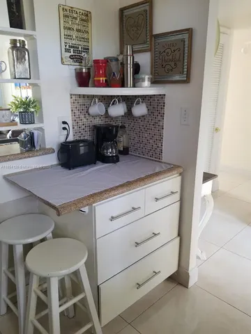 a kitchen with a cabinets and furniture