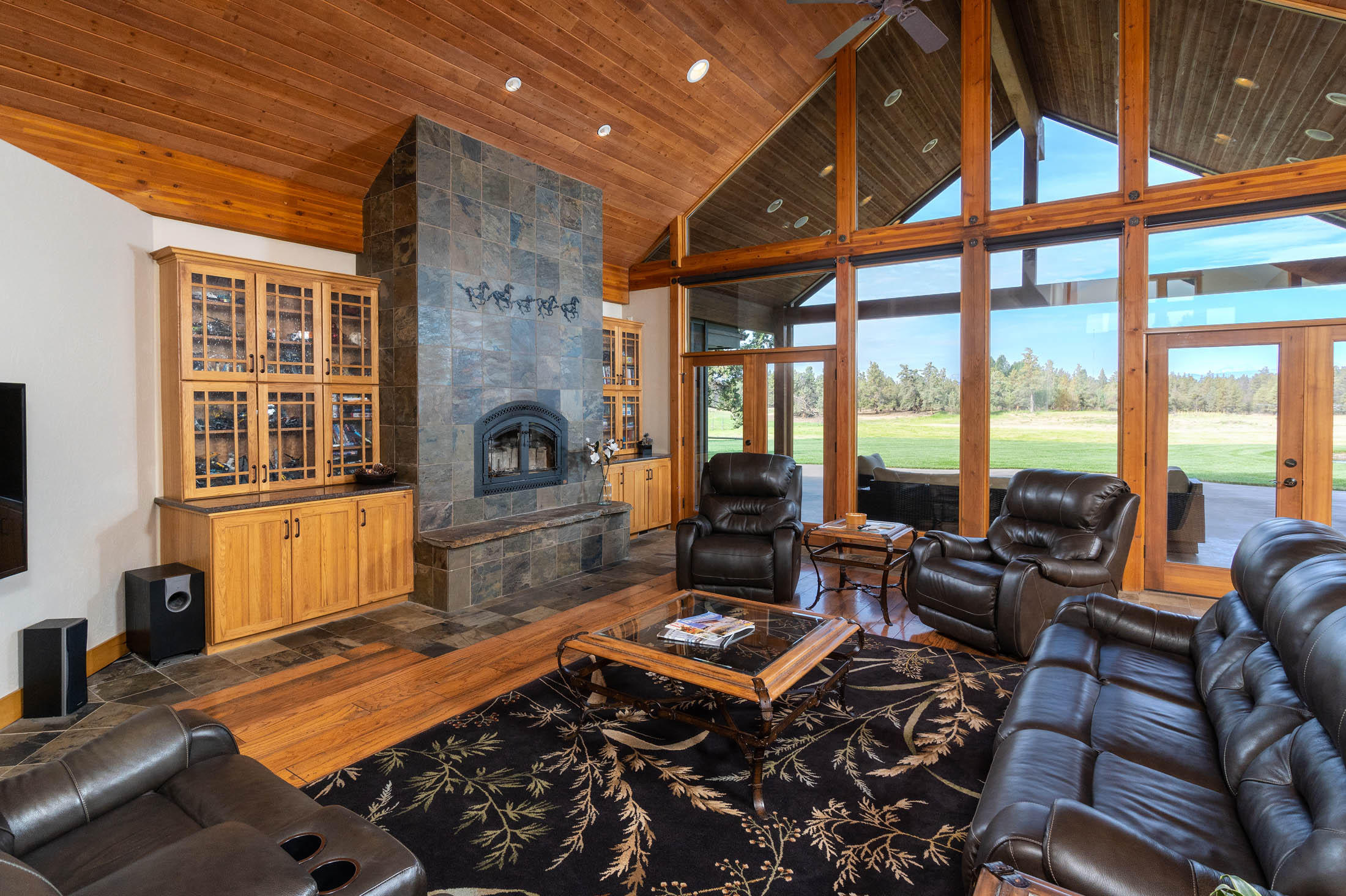 63575 Cricketwood Road Bend, OR 97701 - Photo 11 of 53 a living room with furniture a rug and a floor to ceiling window