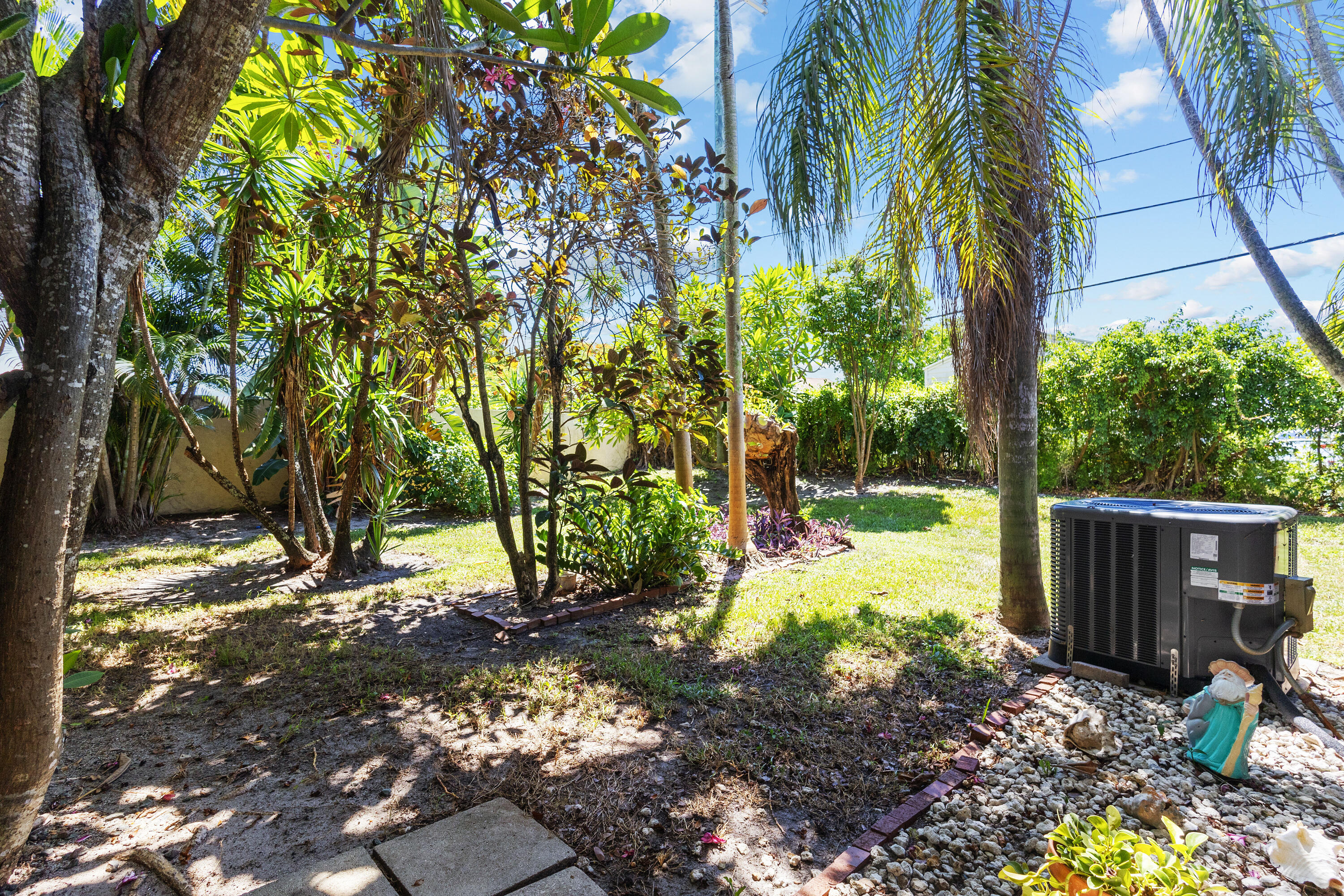 4601 Northwest 2nd Avenue, Unit 811 Boca Raton, FL 33431 - Photo 22 of 30 a view of a yard with plants and trees