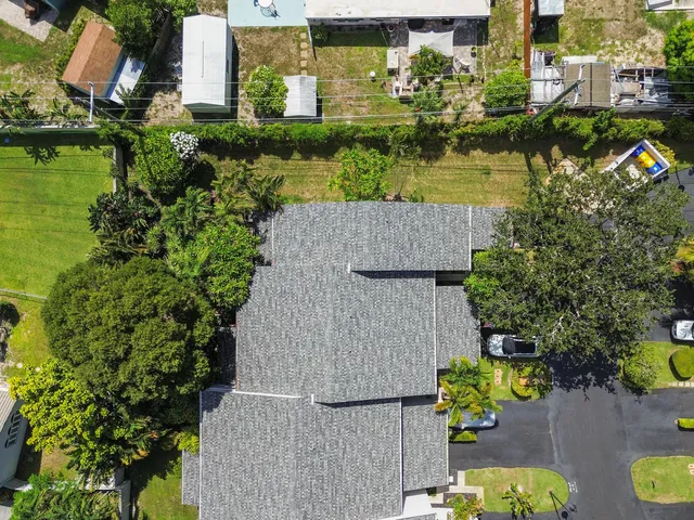 an aerial view of houses with yard