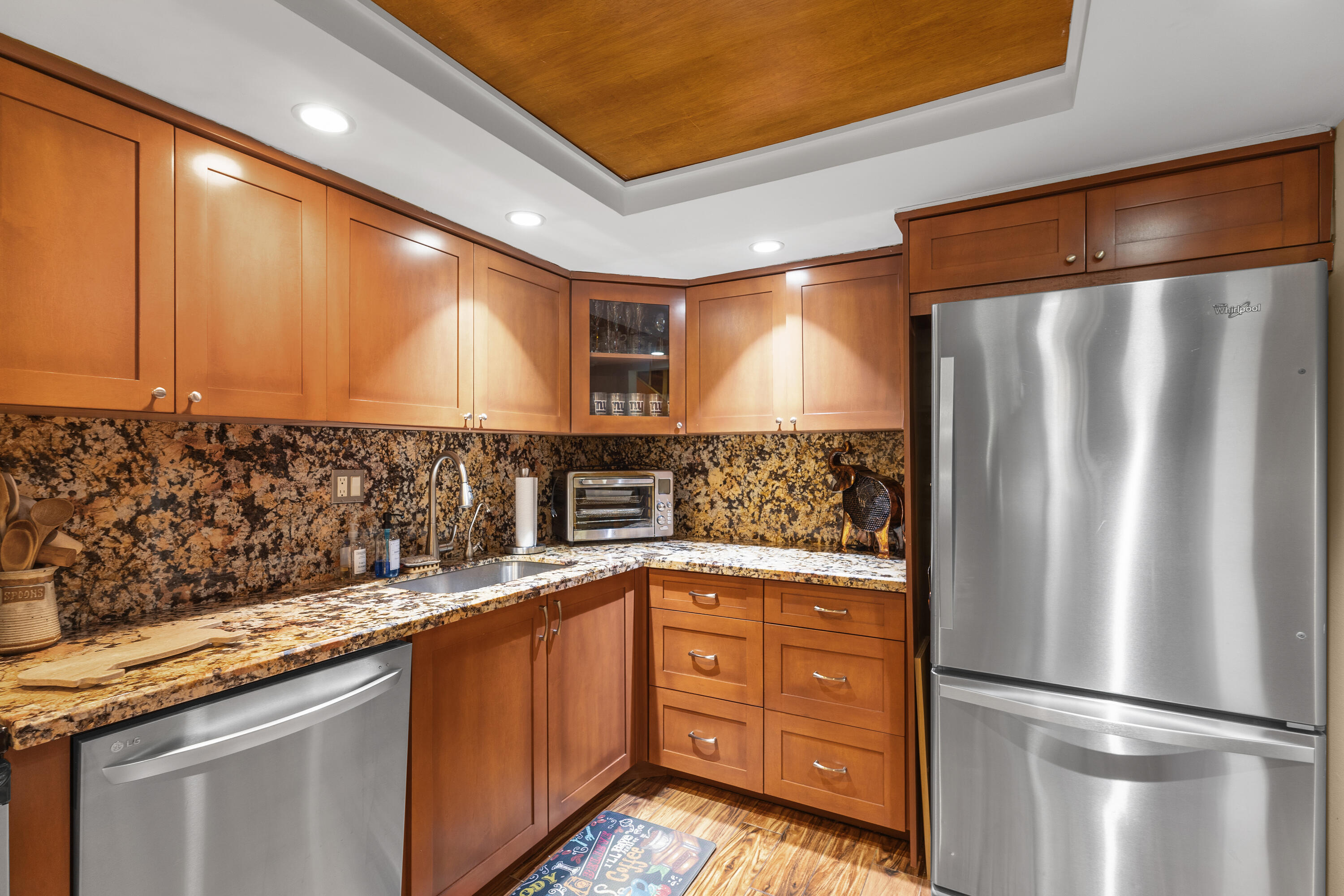4601 Northwest 2nd Avenue, Unit 811 Boca Raton, FL 33431 - Photo 4 of 30 a kitchen with stainless steel appliances granite countertop a refrigerator and a sink