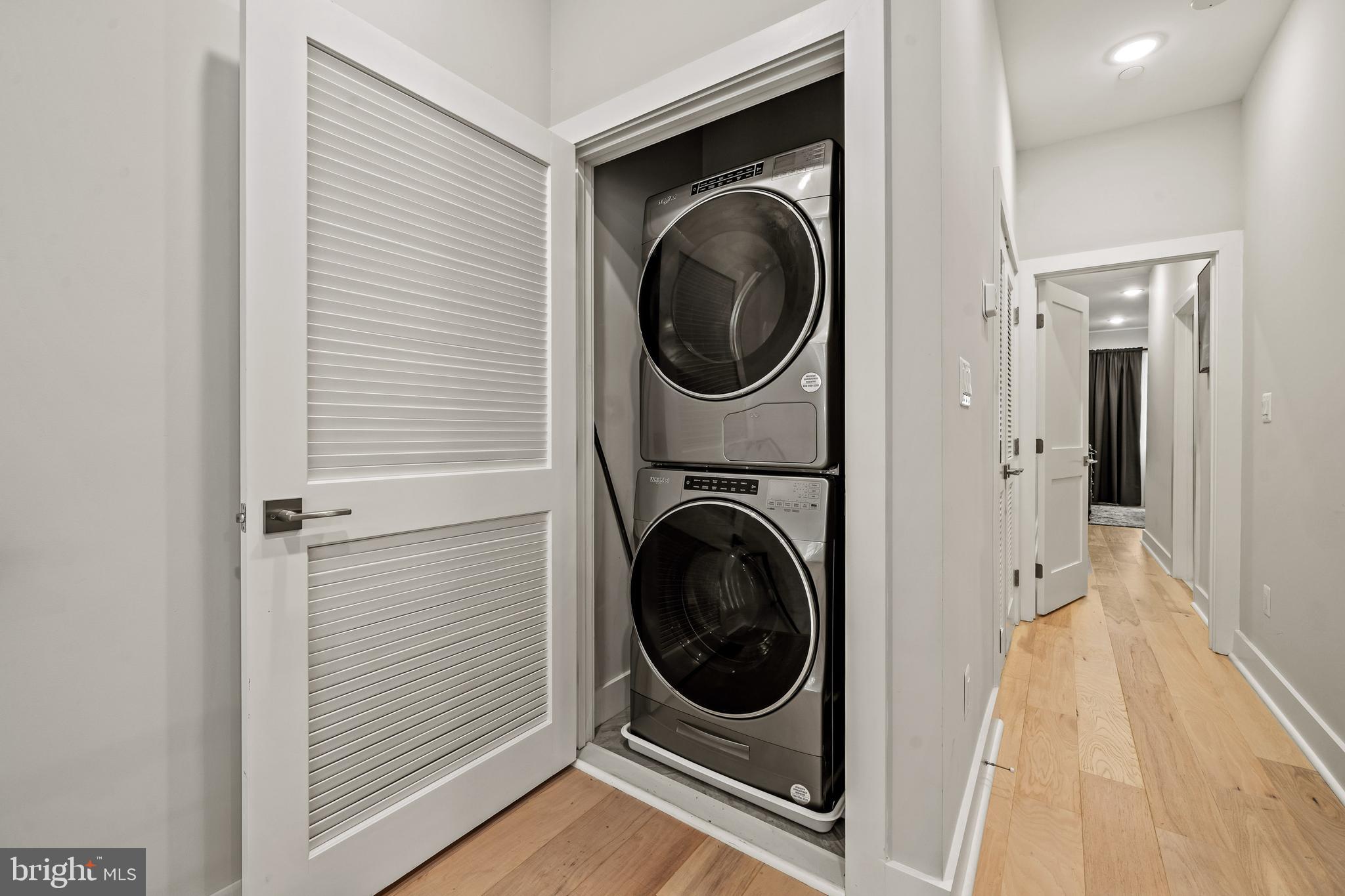 1223 Meigs Place Northeast, Unit 101 Washington, DC 20002 - Photo 13 of 22 a view of a hallway with washer and dryer