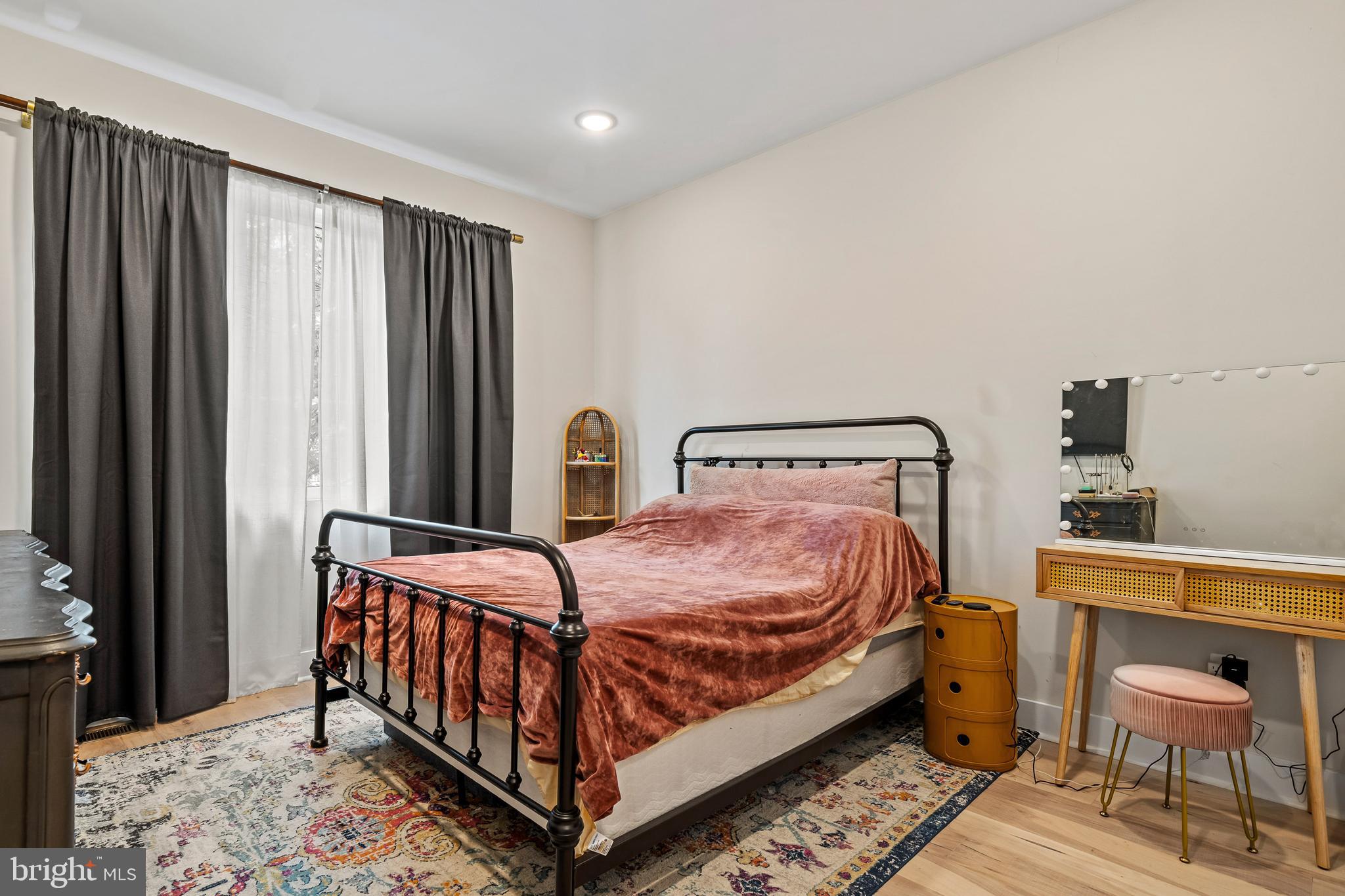 1223 Meigs Place Northeast, Unit 101 Washington, DC 20002 - Photo 15 of 22 a bedroom with a bed and a chair
