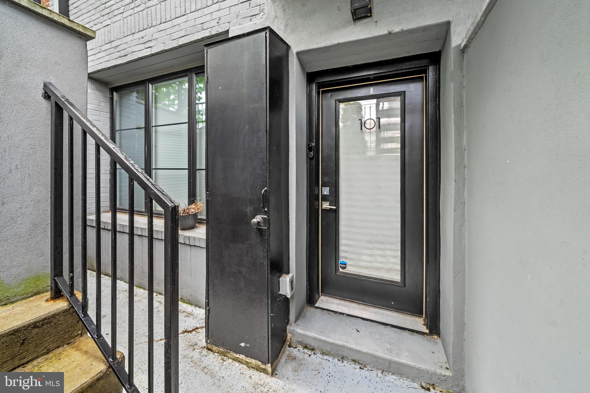 1223 Meigs Place Northeast, Unit 101 Washington, DC 20002 - Photo 4 of 22 a view of a front door and wooden floor