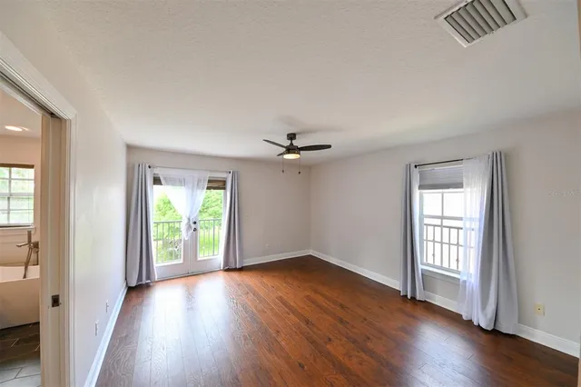 a bathroom with a granite countertop sink a mirror and a shower