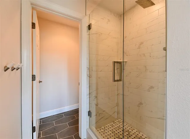 a kitchen with stainless steel appliances kitchen island granite countertop a sink and cabinets