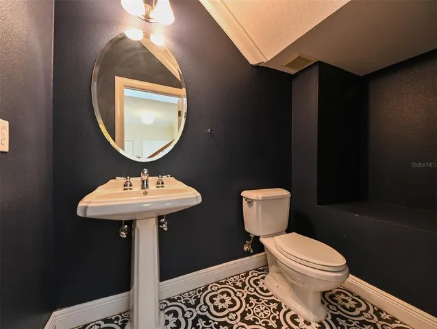 a view of a house with swimming pool and sitting area