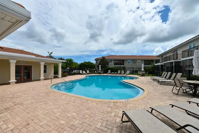 a view of a house with backyard and garden