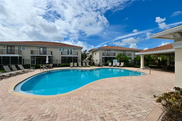 a view of a house with backyard and garden