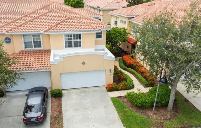 a kitchen with granite countertop a stove and a refrigerator