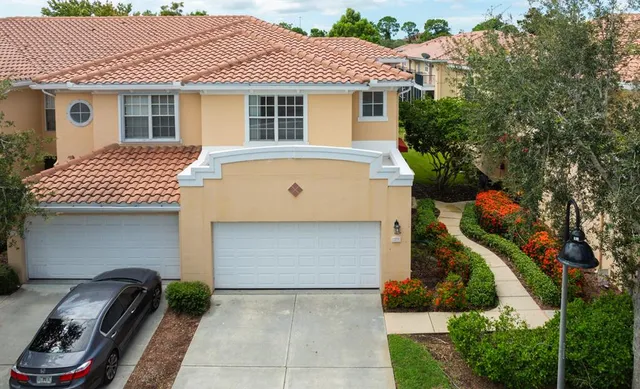 a bathroom with a granite countertop sink toilet a mirror a bathtub and shower