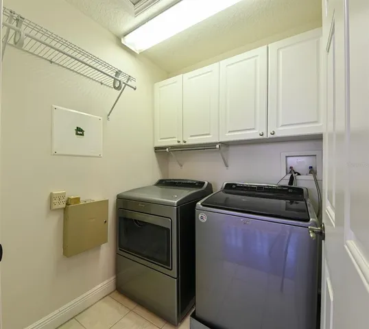 a bathroom with a granite countertop sink toilet a shower and a bathtub