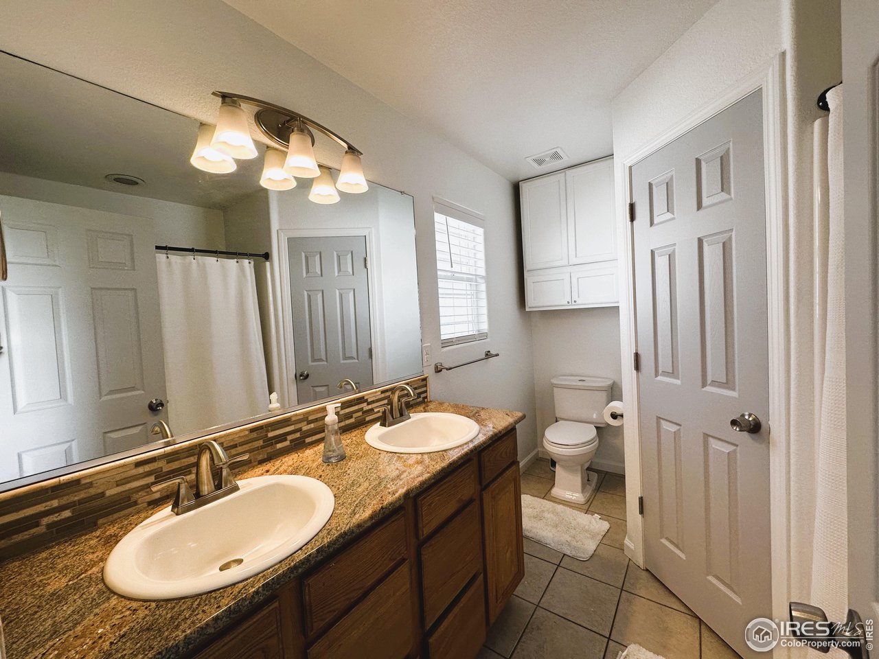 7001 McClellan Road Wellington, CO 80549 - Photo 13 of 20 Dual vanities and granite countertops