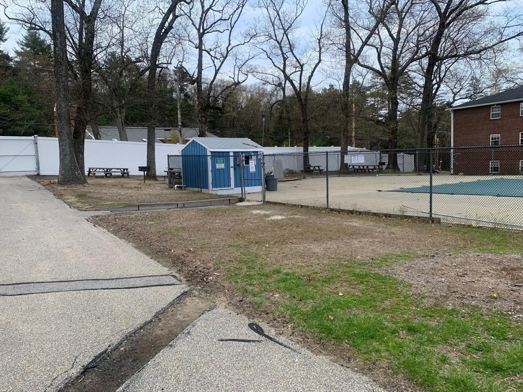 249 Boston Post Road East, Unit 4 Marlborough, MA 01752 - Photo 11 of 11 a view of a large house with a yard