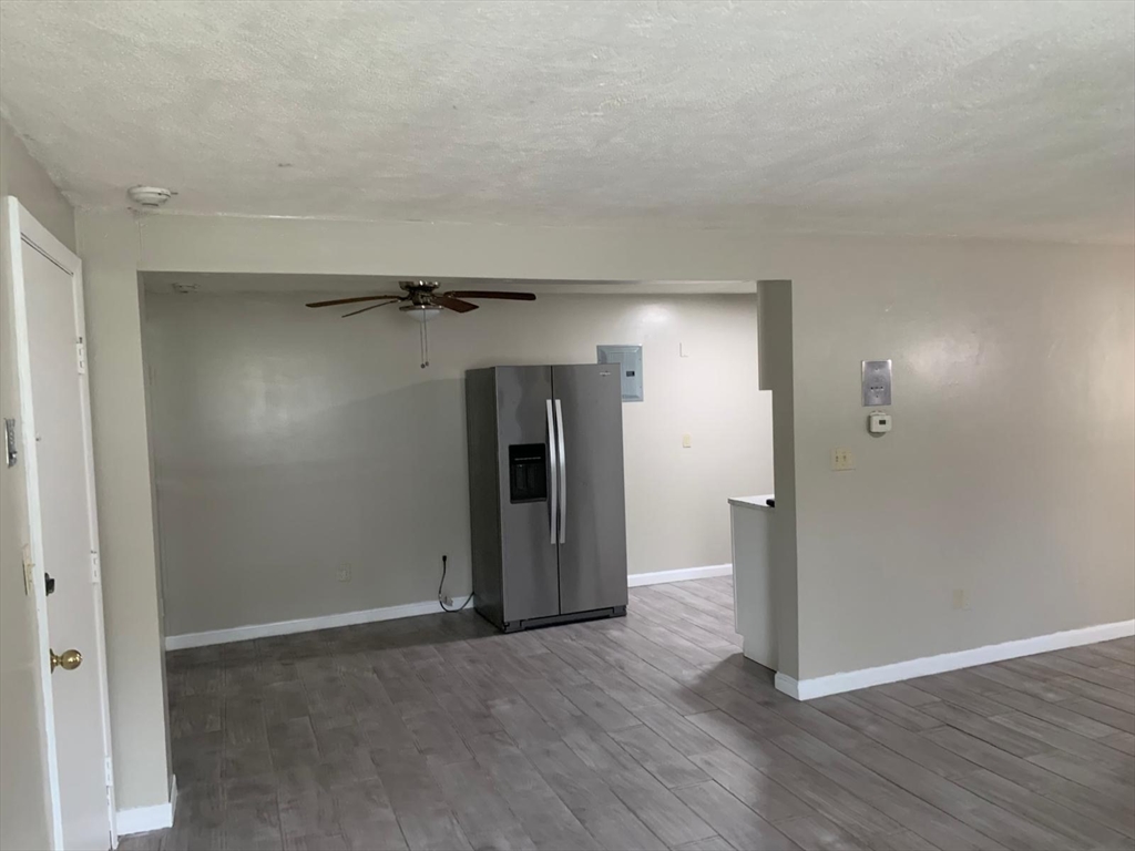 249 Boston Post Road East, Unit 4 Marlborough, MA 01752 - Photo 4 of 11 a view of a room with wooden floor