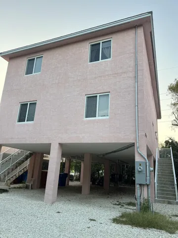a front view of a house with parking
