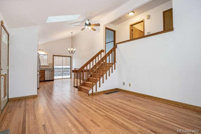 567 James Street Highlands Ranch, CO 80126 - Photo 4 of 17 a view of entryway with wooden floor