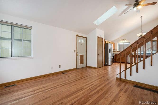 567 James Street Highlands Ranch, CO 80126 - Photo 5 of 17 a view of empty room with wooden floor and fan