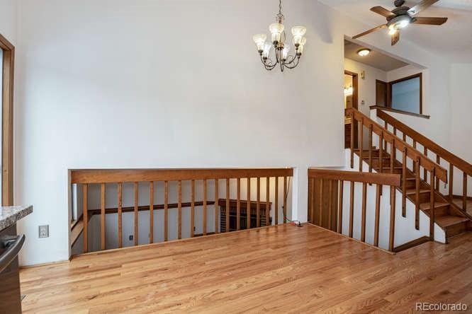 567 James Street Highlands Ranch, CO 80126 - Photo 9 of 17 a view of a bedroom with wooden floor