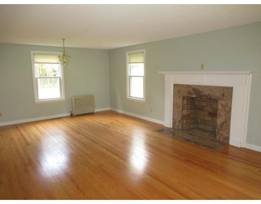 70 East Longmeadow Road Hampden, MA 01036 - Photo 11 of 38 an empty room with wooden floor windows and fireplace