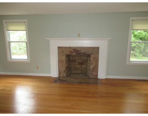 70 East Longmeadow Road Hampden, MA 01036 - Photo 12 of 38 an empty room with wooden floor fireplace and windows