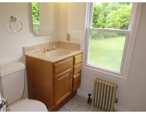 70 East Longmeadow Road Hampden, MA 01036 - Photo 14 of 38 a bathroom with a sink a toilet and a mirror
