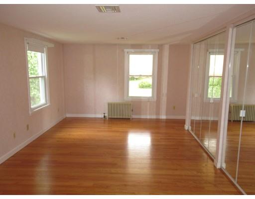 70 East Longmeadow Road Hampden, MA 01036 - Photo 19 of 38 a view of empty room with wooden floor and fan