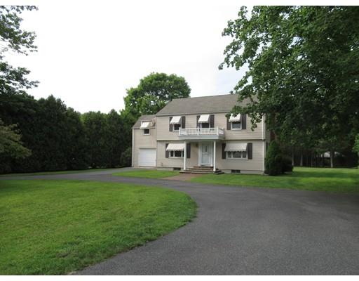 70 East Longmeadow Road Hampden, MA 01036 - Photo 38 of 38 a view of a white house in front of a big yard with plants and large trees