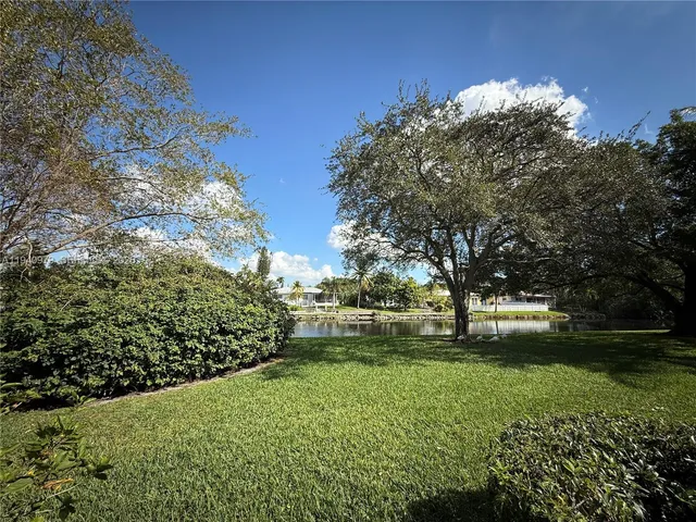 a view of backyard with green space