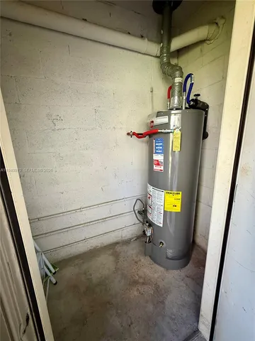 a view of storage and utility room with a sink