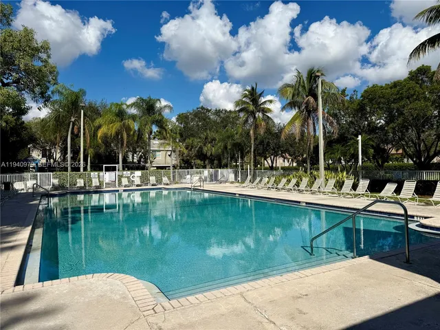 a view of swimming pool with a yard