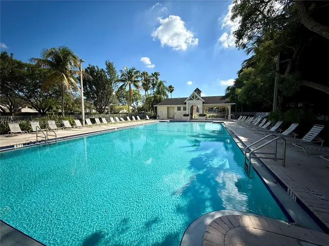 a view of a swimming pool with a patio