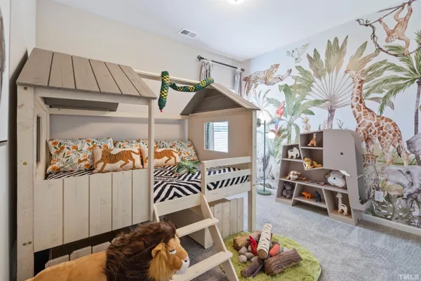 a bedroom with a bed and a couch