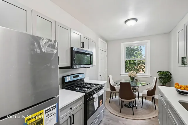 a kitchen with a stove and a microwave