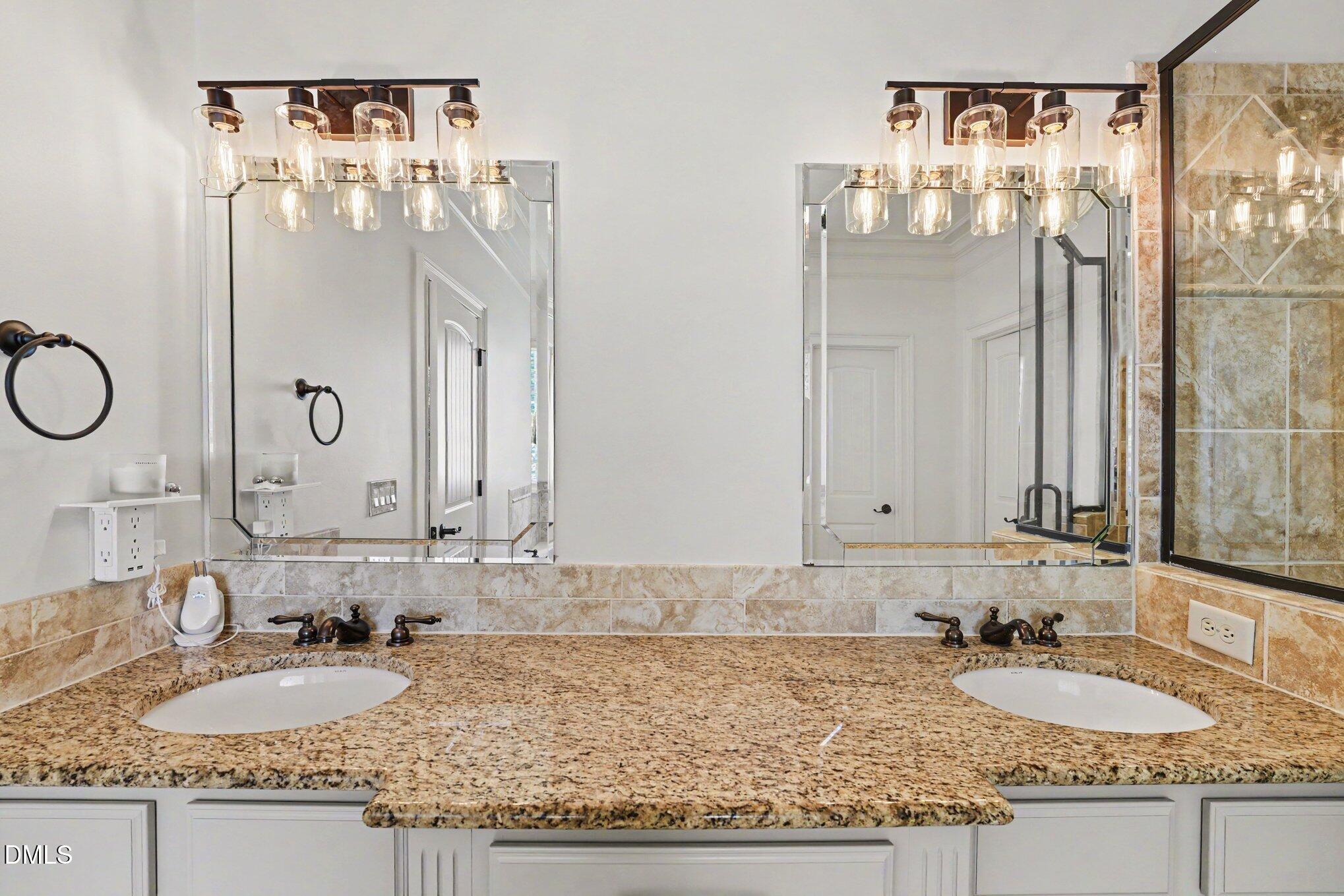 1729 Frenchwood Drive Raleigh, NC 27612 - Photo 14 of 46 a bathroom with a granite countertop sink and a mirror