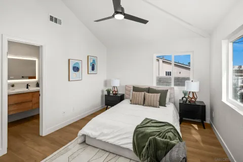 a bedroom with a bed and a couch