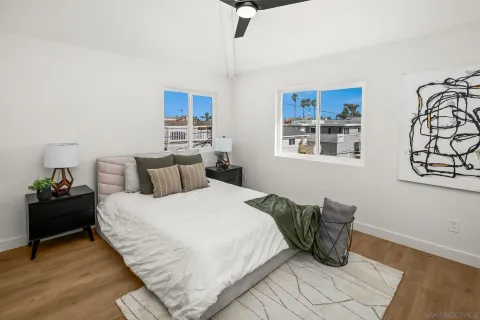 a bedroom with bed and window