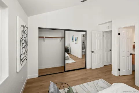 a view of a livingroom with wooden floor and closet