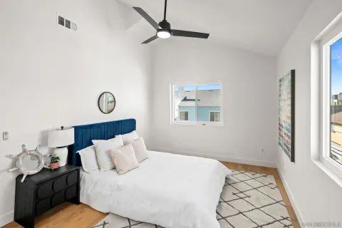 a bedroom with a bed and window