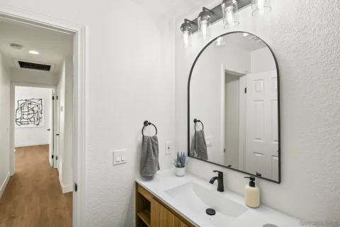 a bathroom with a sink and a mirror