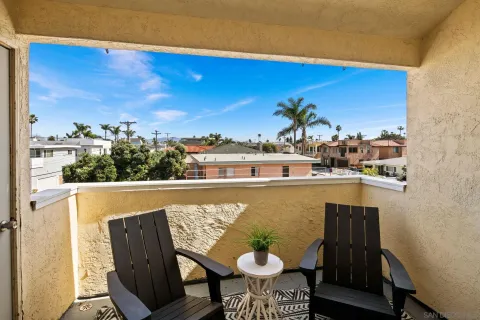 a view of a balcony with chair and table